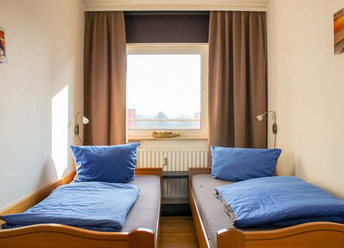 Strandhochhaus 12 - Schlafzimmer - Cuxland-Fewo-Service